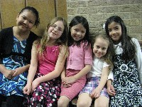 Girls seated in hallway