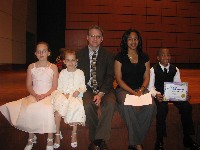 Teacher sits with four students